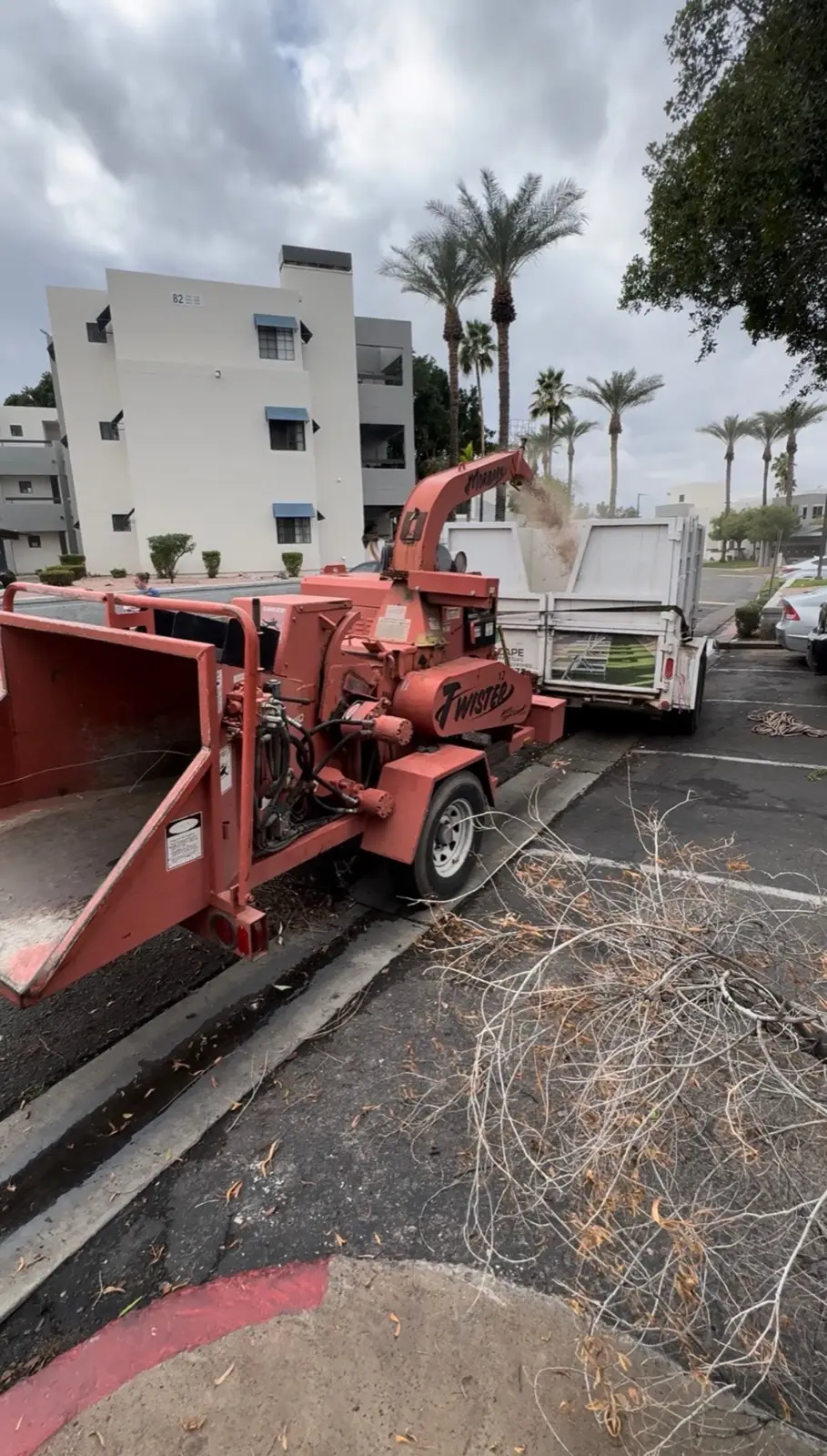 Debris hauling and cleanup operation underway at a multifamily site.